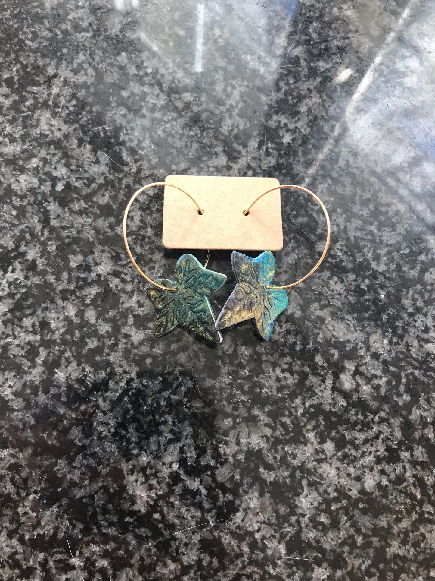 Ivy in green/gold on hoop earrings