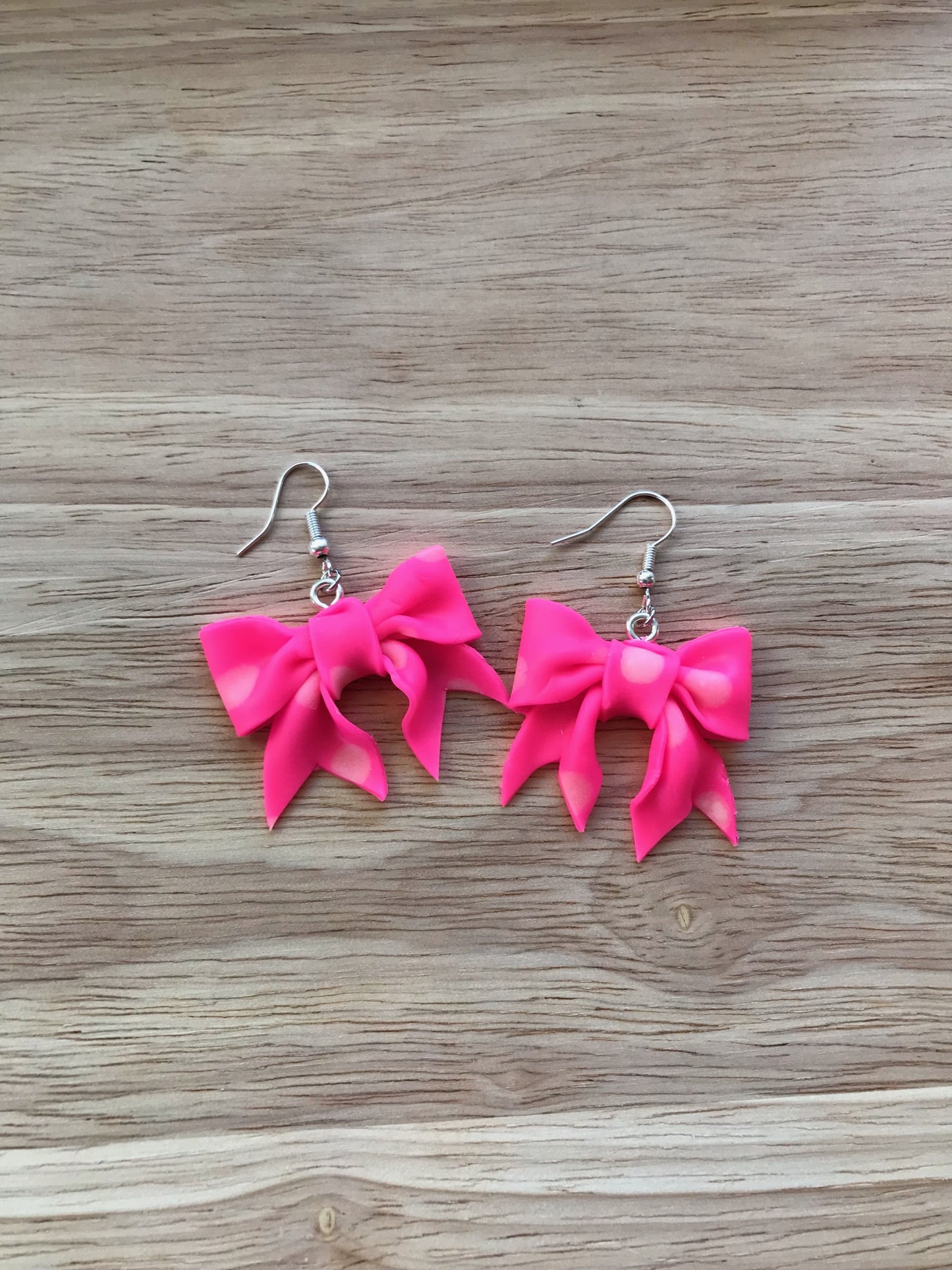 V-Day neon-pink bows with glow-in-the-dark dots